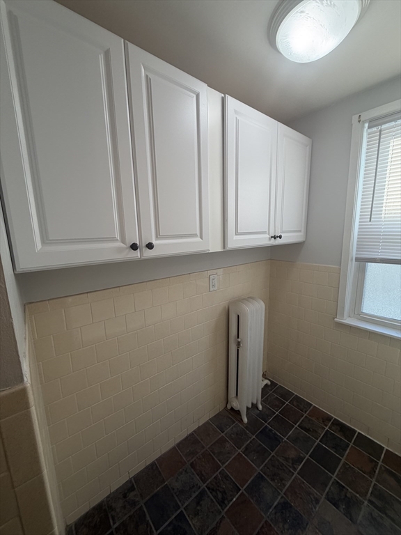 23 Saunders Street, Unit 25F North Andover, MA 01845 - Photo 8 of 12 a room with storage and utility