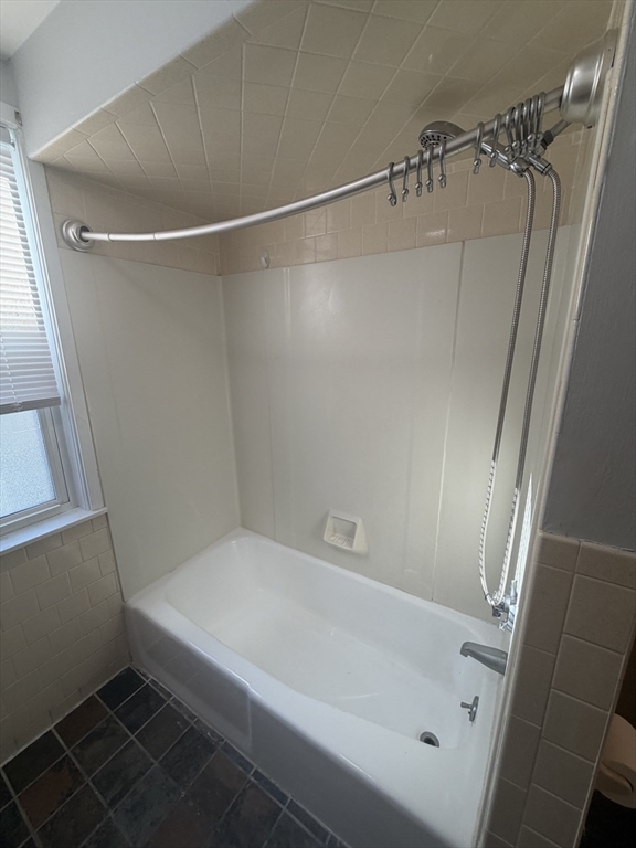 23 Saunders Street, Unit 25F North Andover, MA 01845 - Photo 9 of 12 a bathroom with a bathtub and a shower