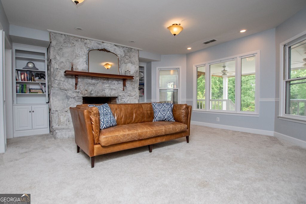 1745 Stripling Chapel Road Carrollton, GA 30116 - Photo 45 of 69 a living room with furniture and a fireplace