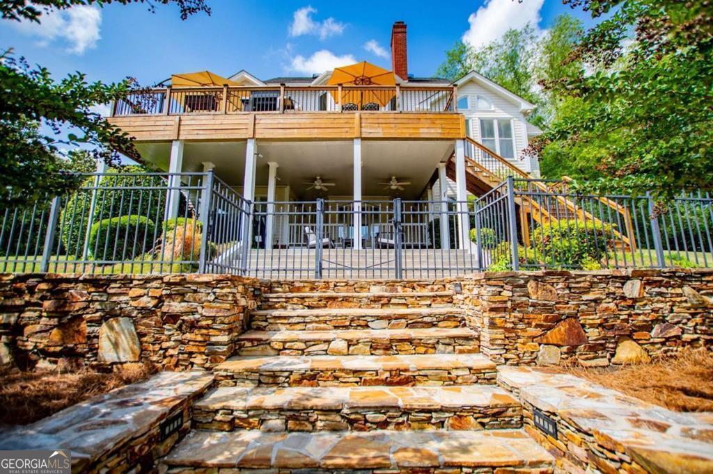 1745 Stripling Chapel Road Carrollton, GA 30116 - Photo 54 of 69 a view of a house with floor to ceiling windows and a rug