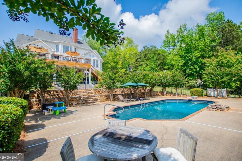 1745 Stripling Chapel Road Carrollton, GA 30116 - Photo 60 of 69 a view of a swimming pool with a patio