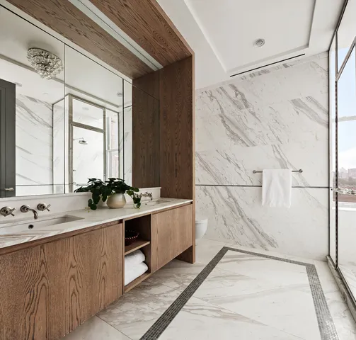 a bathroom with a double vanity sink and mirror