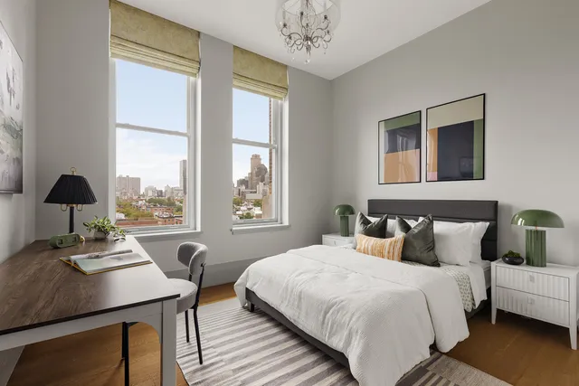 a bedroom with a bed and a table