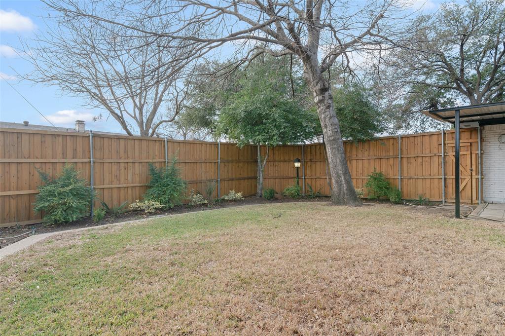 4606 Hazelhurst Lane Dallas, TX 75227 - Photo 29 of 30 a view of backyard and tree