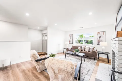 a living room with furniture and a table