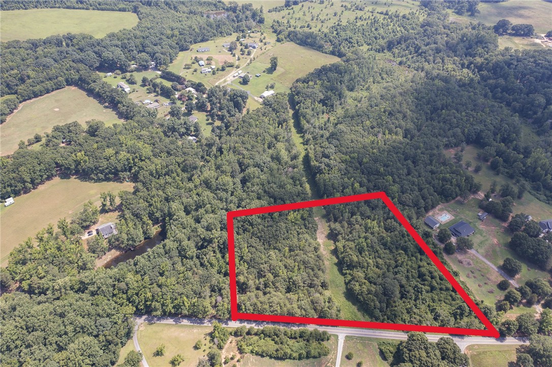 Lot 1 Austin Road Honea Path, SC 29654 - Photo 2 of 7 A verdant parcel of land outlined in red offers future possibilities for development or rural enjoyment.