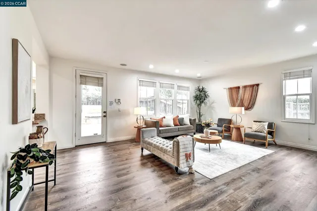 a kitchen with stainless steel appliances kitchen island granite countertop a sink and cabinets