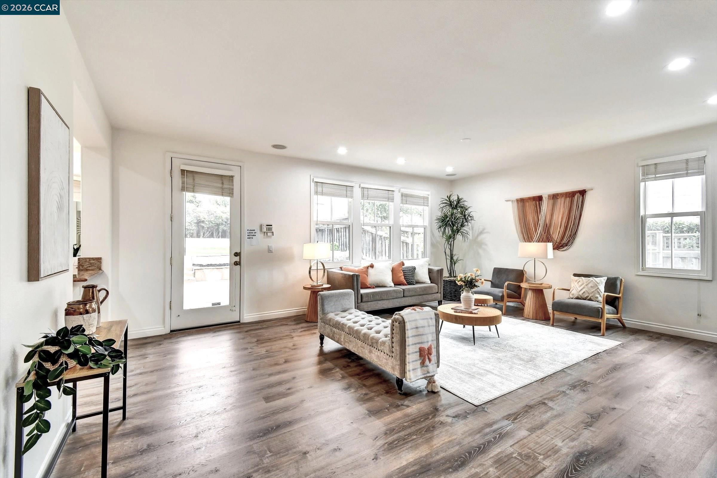 1018 Promenade Street Hercules, CA 94547 - Photo 16 of 60 a living room with furniture and wooden floor