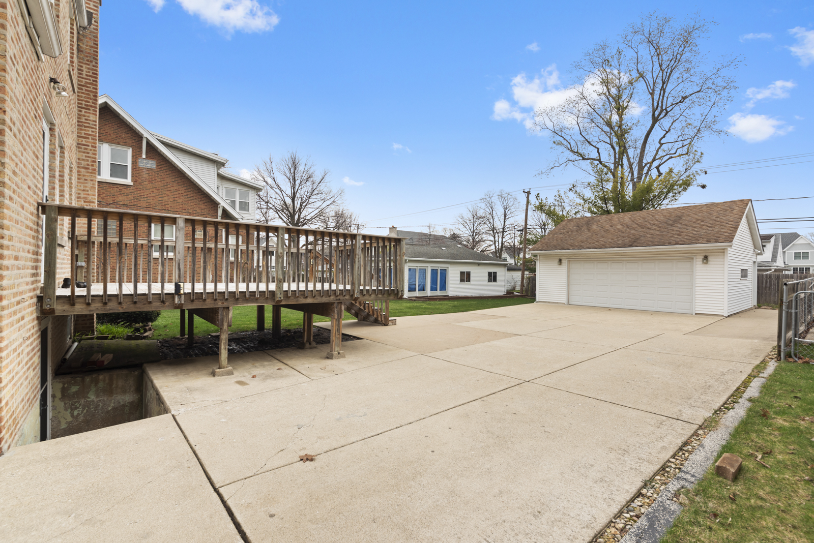 627 Spring Road Elmhurst, IL 60126 - Photo 20 of 20 a view of a house with a patio and a yard