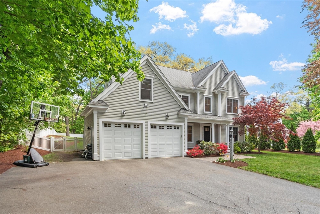 56 Old Marlboro Road Concord, MA 01742 - Photo 31 of 34 a view of a house with a yard and garage