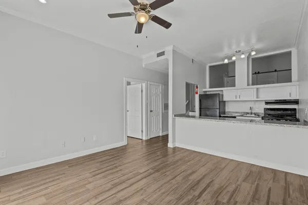 a view of a kitchen from the hallway