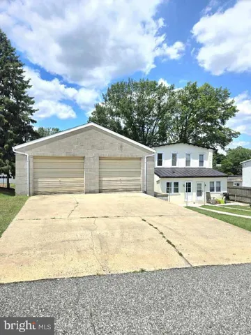 a view of a garden with an outdoor space