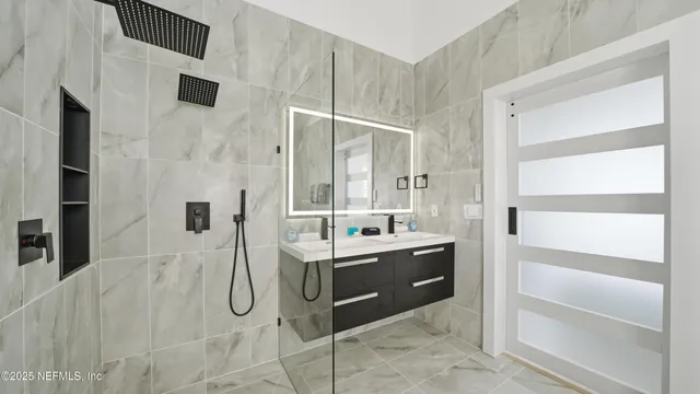 a bathroom with a shower toilet and a shower