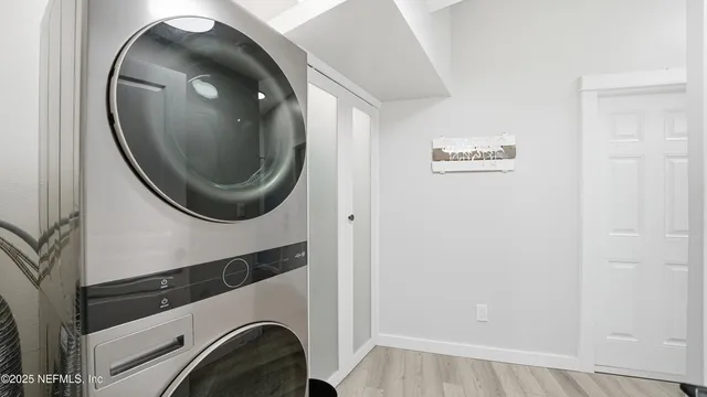 an aerial view of a residential apartment building with a yard