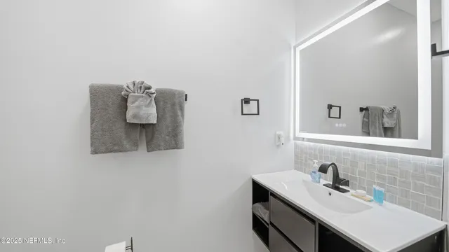 a picture of a bathroom with a shower