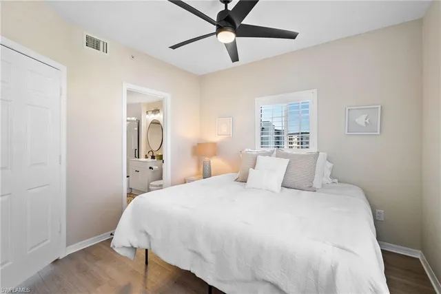 a bathroom with a bathtub shower sink mirror and toilet