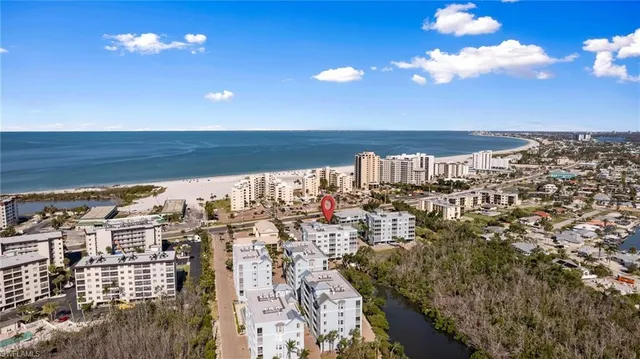a view of kitchen and dining room with wooden floor