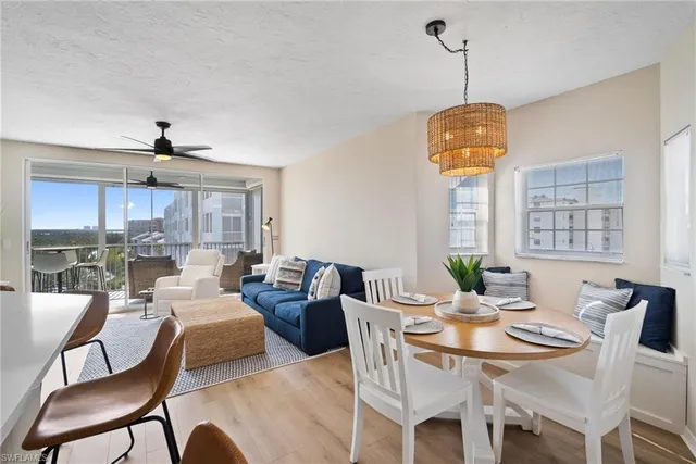 a dining room with furniture and window