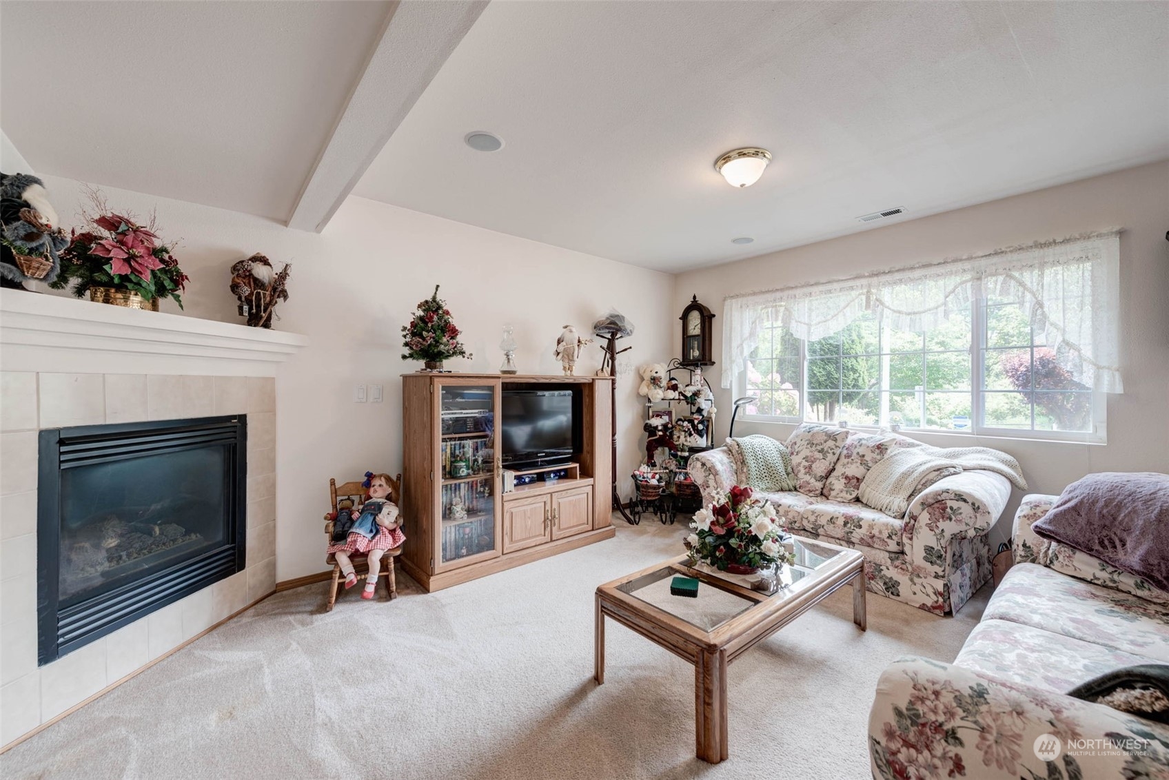225 99th Place Southwest Everett, WA 98204 - Photo 17 of 30 a living room with furniture a fireplace and a flat screen tv