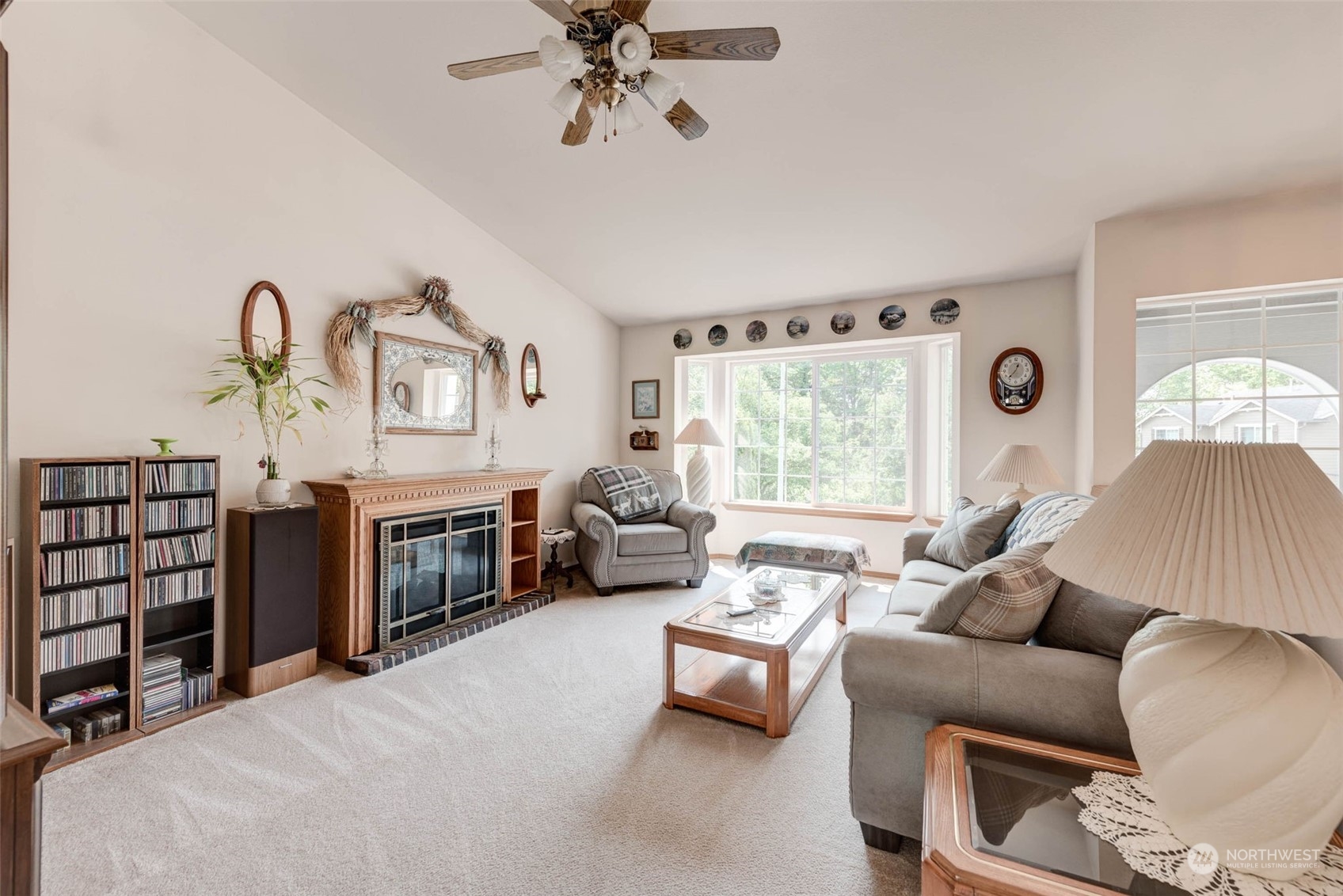 225 99th Place Southwest Everett, WA 98204 - Photo 3 of 30 a living room with furniture a fireplace and a window