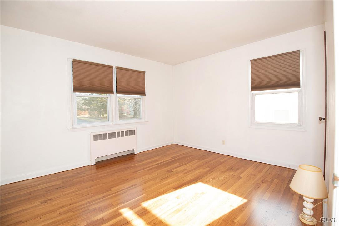 3003 Cornwall Road Bethlehem, PA 18017 - Photo 11 of 27 a view of an empty room with wooden floor and a window