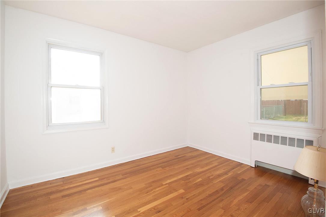 3003 Cornwall Road Bethlehem, PA 18017 - Photo 14 of 27 a view of an empty room with wooden floor and a window