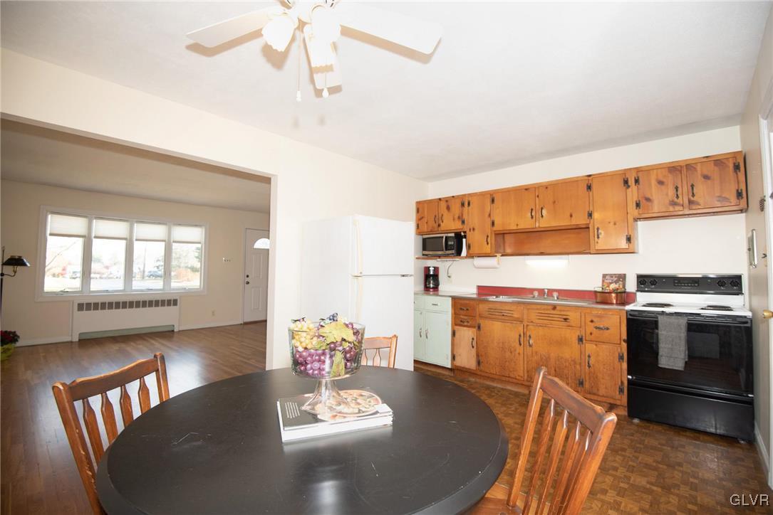 3003 Cornwall Road Bethlehem, PA 18017 - Photo 9 of 27 a kitchen with a table chairs and stove