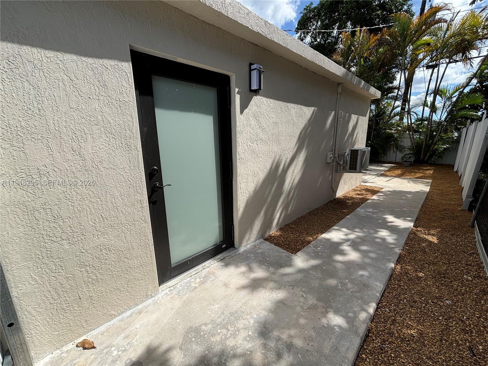 30 East 44th Street, Unit 30 Hialeah, FL 33013 - Photo 8 of 16 a view of a house with a door