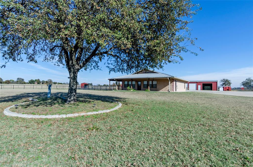 395 Yacht Club Road Oak Point, TX 75068 - Photo 21 of 23 View of yard with a garage and an outbuilding