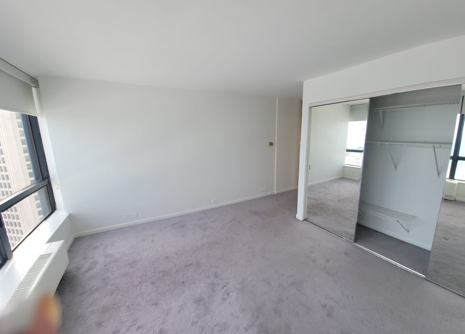 5415 North Sheridan Road, Unit 2805 Chicago, IL 60640 - Photo 11 of 23 an empty room with windows