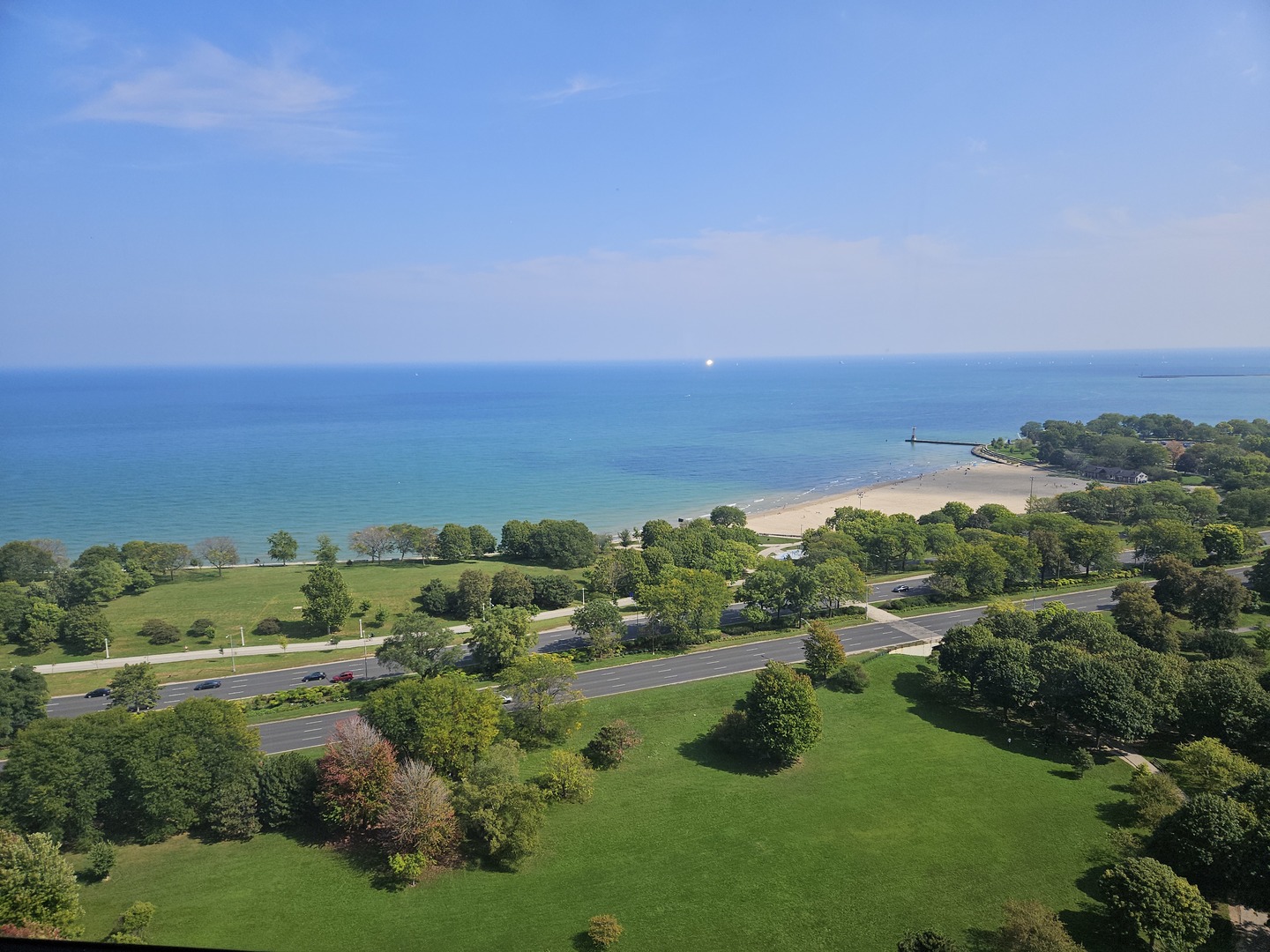 5415 North Sheridan Road, Unit 2805 Chicago, IL 60640 - Photo 2 of 23 a view of lake with lots of trees