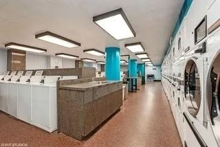 a large white kitchen with lots of counter top space