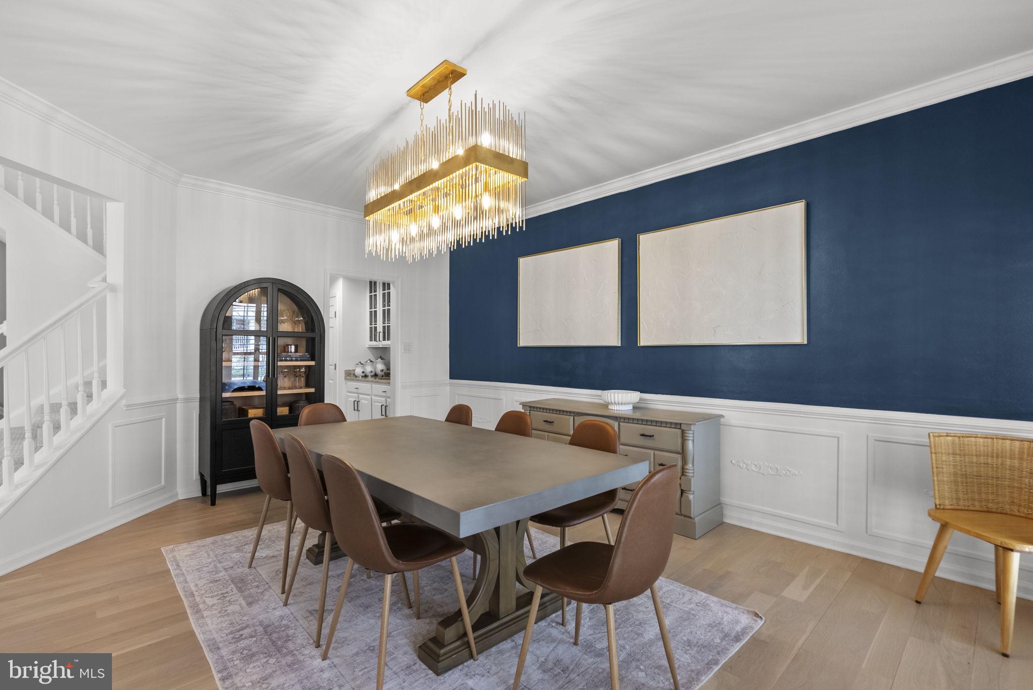 1339 Main Street Gaithersburg, MD 20878 - Photo 16 of 73 a view of a dining room with furniture and chandelier