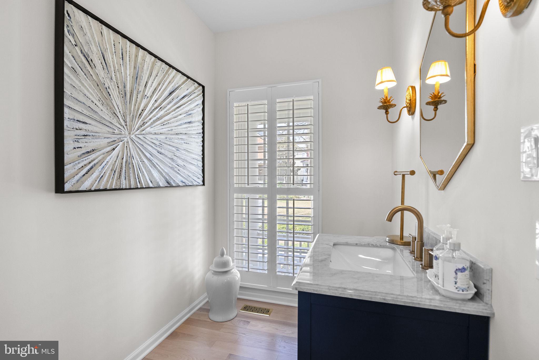 1339 Main Street Gaithersburg, MD 20878 - Photo 25 of 73 a bathroom with a sink and a mirror