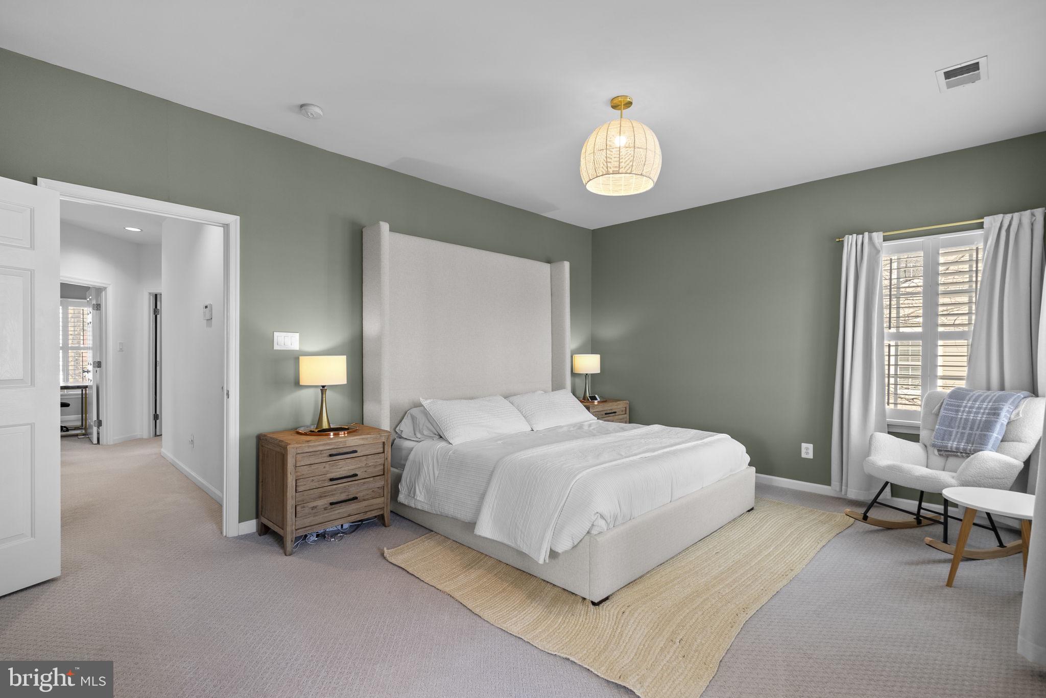1339 Main Street Gaithersburg, MD 20878 - Photo 27 of 73 a bedroom with a bed and a chandelier