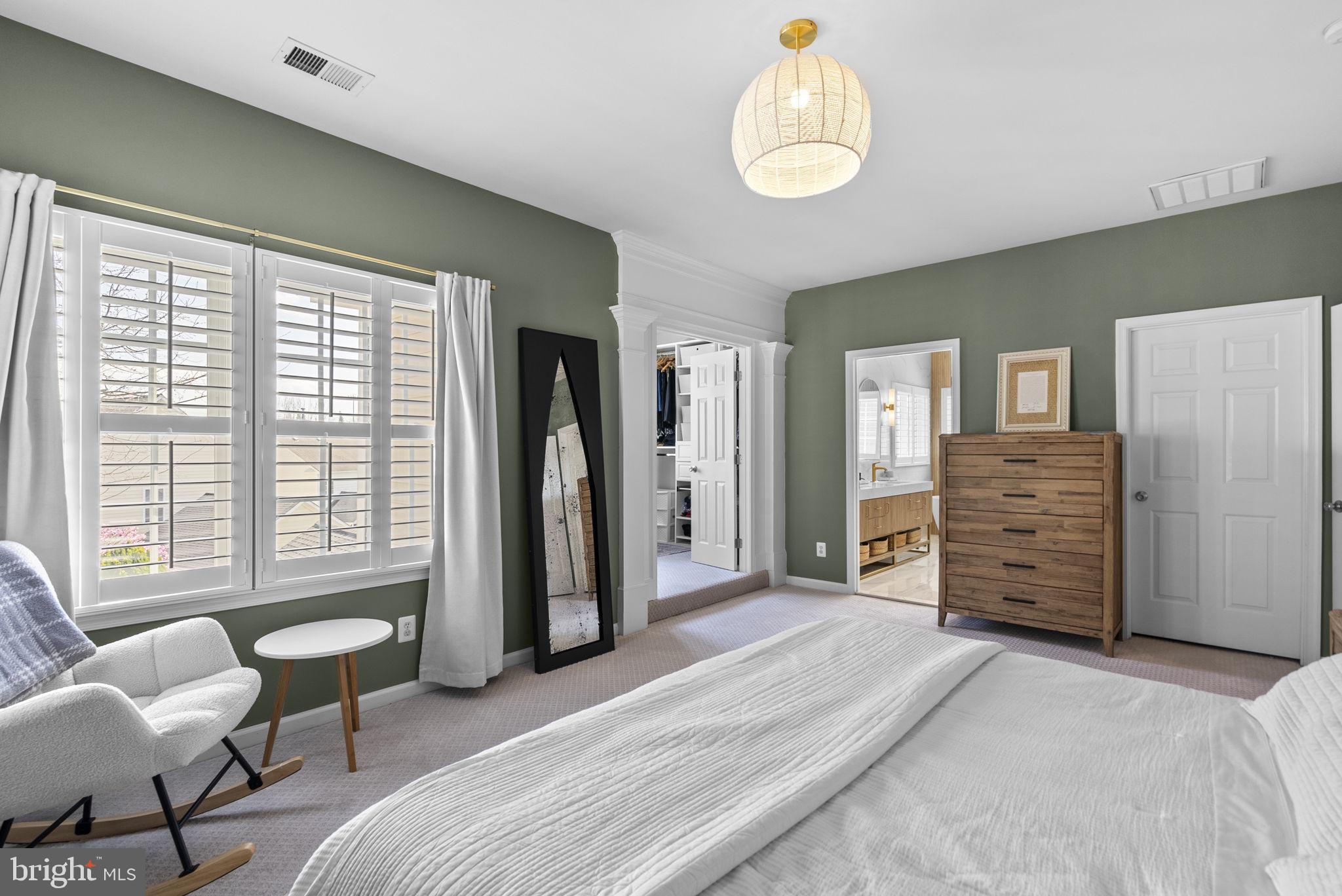 1339 Main Street Gaithersburg, MD 20878 - Photo 28 of 73 a spacious bedroom with a bed and furniture
