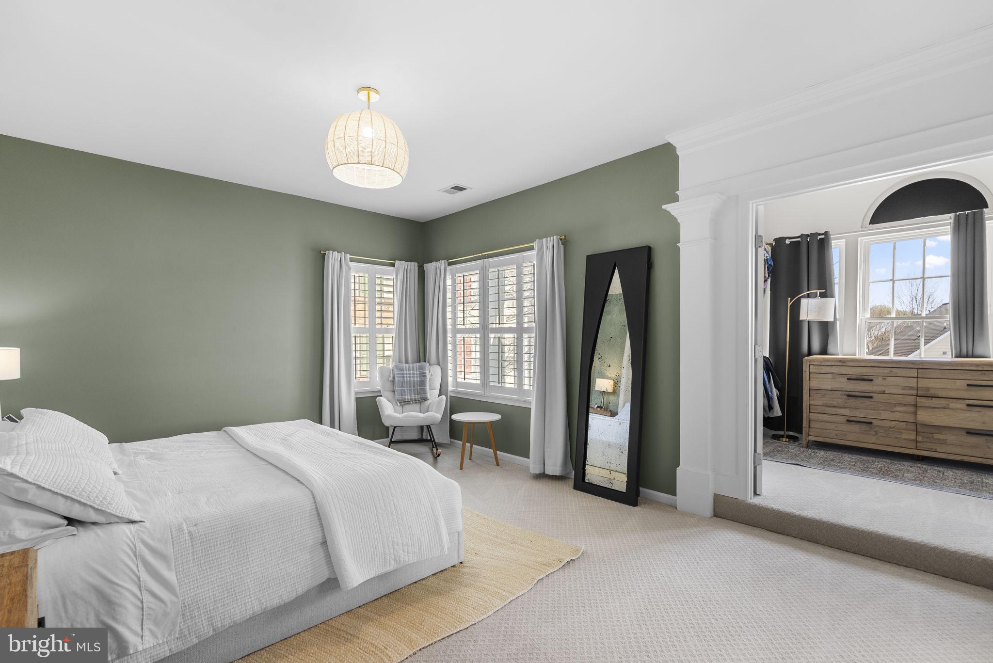 1339 Main Street Gaithersburg, MD 20878 - Photo 29 of 73 a bedroom with a bed and a large mirror on the dresser