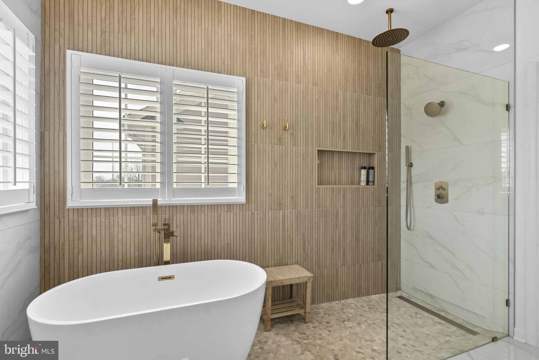 1339 Main Street Gaithersburg, MD 20878 - Photo 32 of 73 a bathroom with a tub a toilet and a shower
