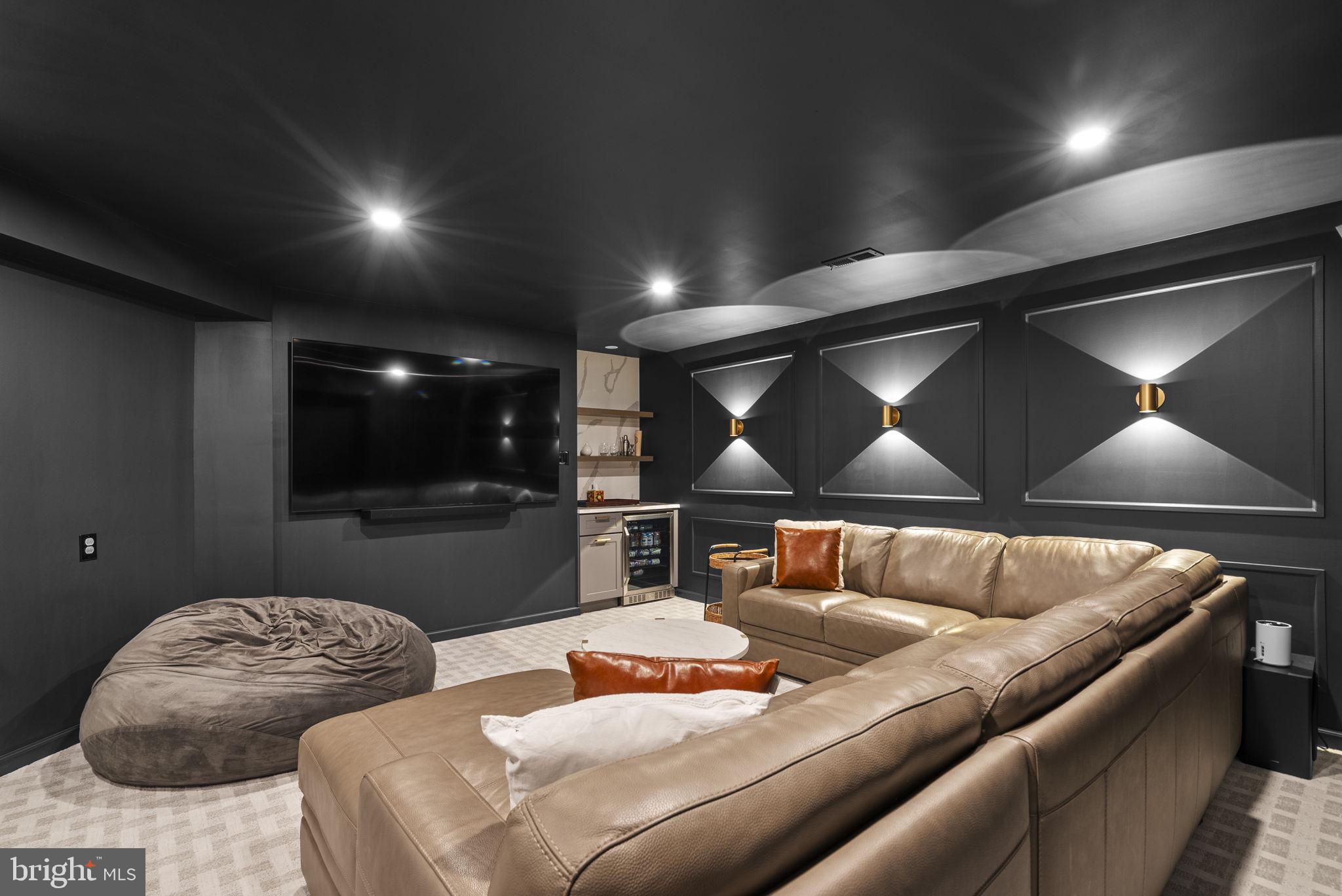 1339 Main Street Gaithersburg, MD 20878 - Photo 45 of 73 a living room with furniture and a projector screen