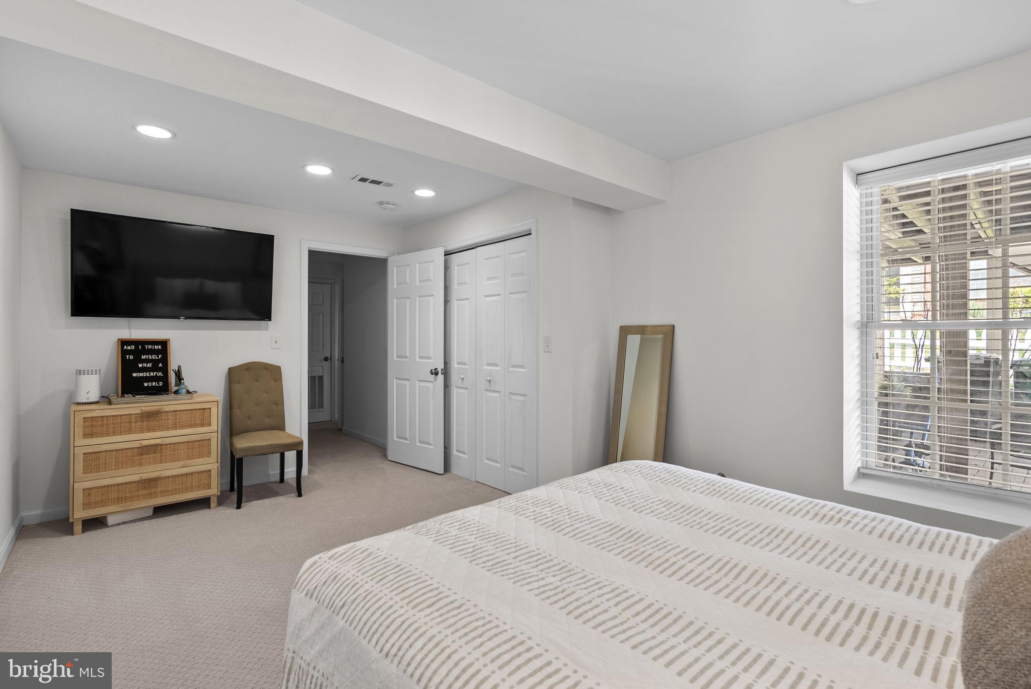 1339 Main Street Gaithersburg, MD 20878 - Photo 49 of 73 a bedroom with a bed and a flat screen tv