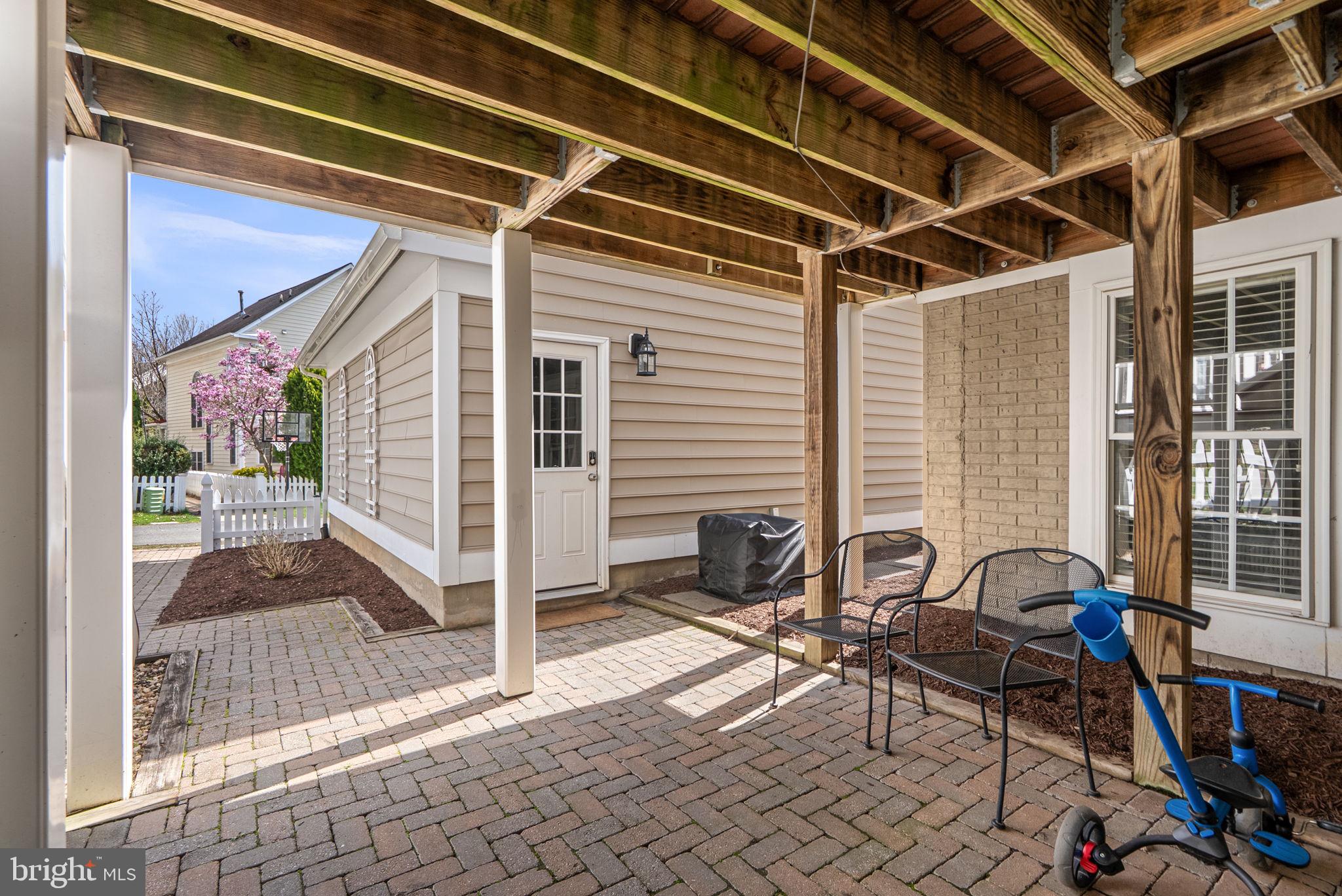1339 Main Street Gaithersburg, MD 20878 - Photo 54 of 73 a view of a patio with table and chairs and wooden floor