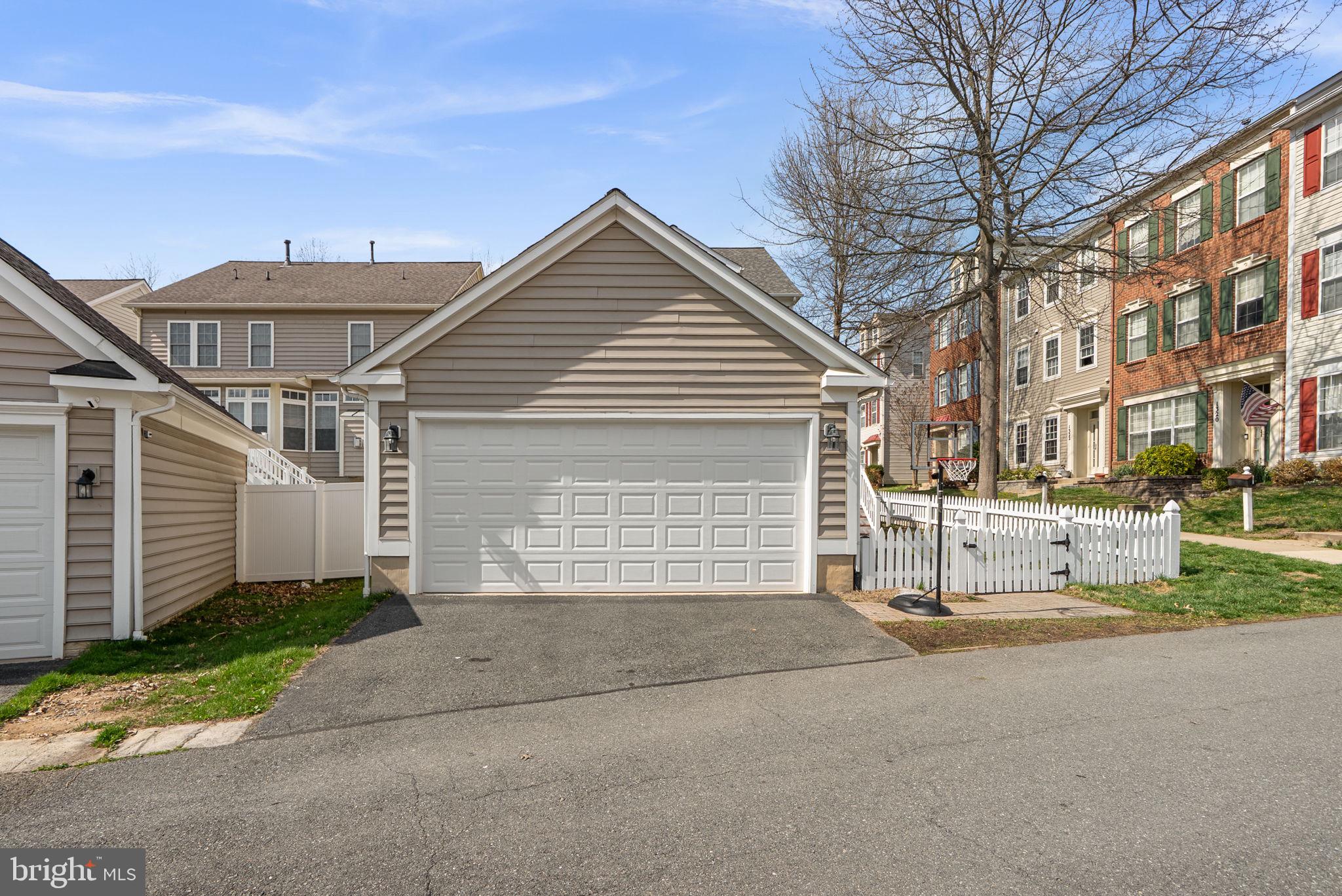 1339 Main Street Gaithersburg, MD 20878 - Photo 56 of 73 a view of a house with a yard and garage
