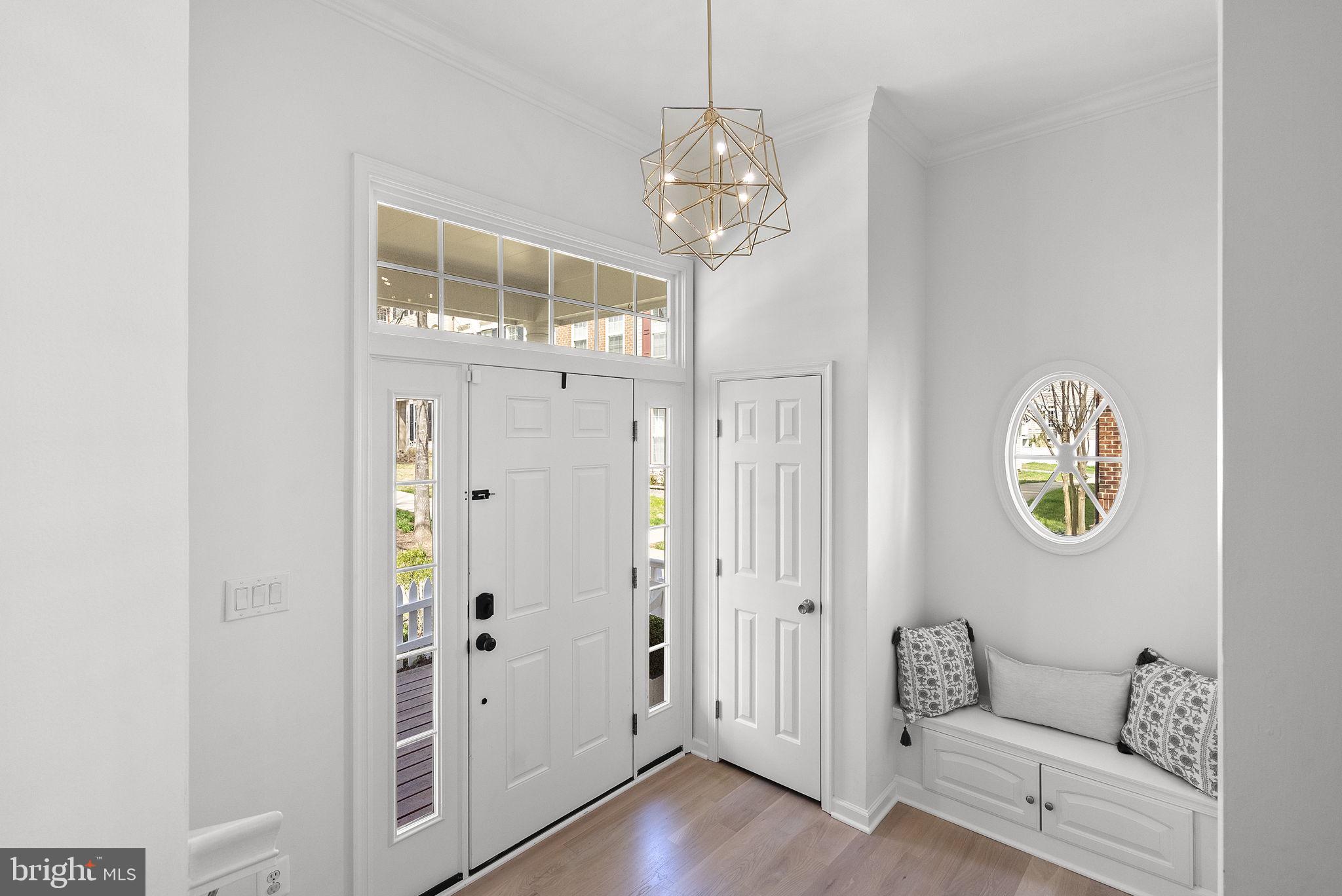 1339 Main Street Gaithersburg, MD 20878 - Photo 6 of 73 a view of a hallway with wooden floor and staircase
