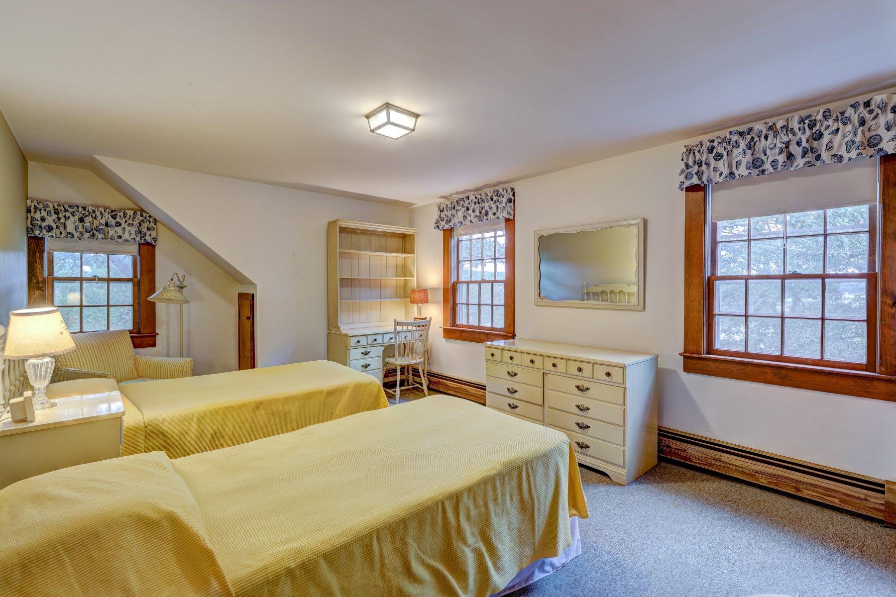 40 Viking Road Orleans, MA 02653 - Photo 13 of 27 a bedroom with a bed and a dresser