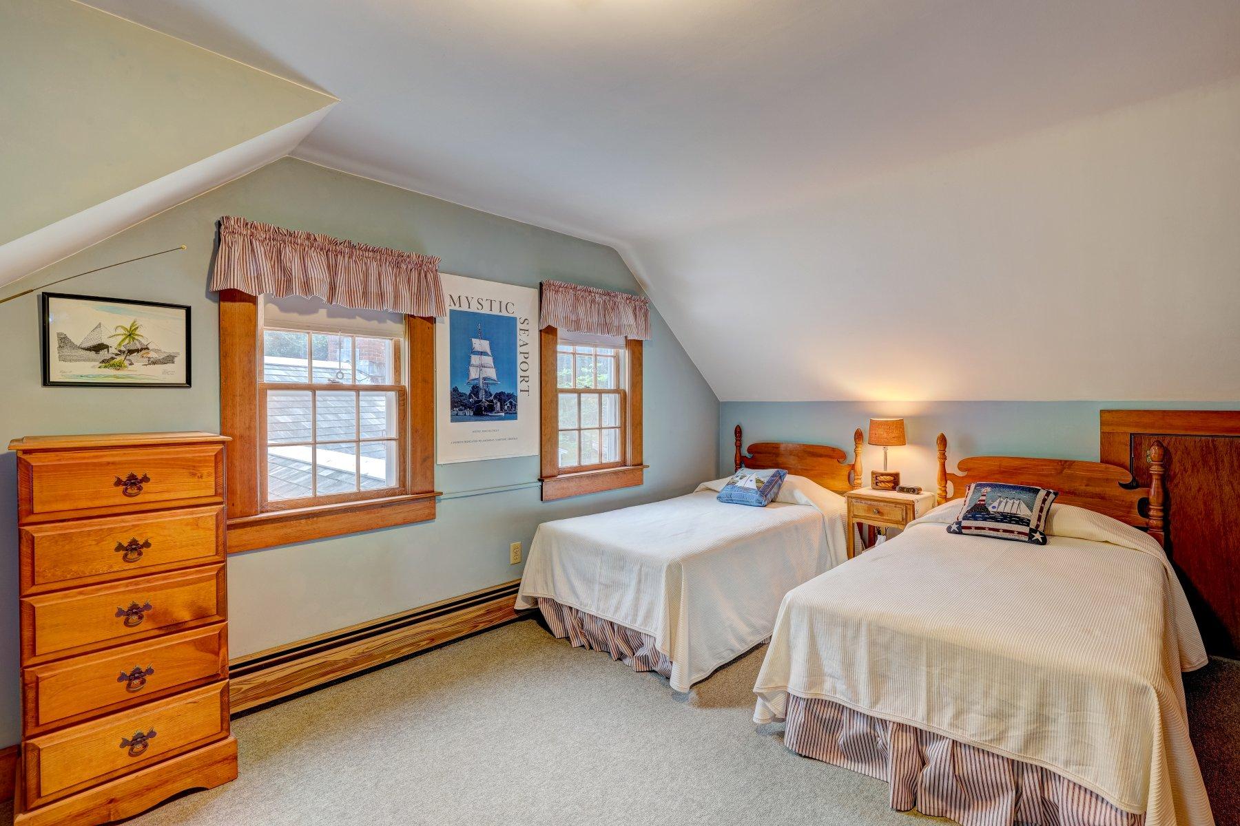 40 Viking Road Orleans, MA 02653 - Photo 16 of 27 a bedroom with two beds and painted walls