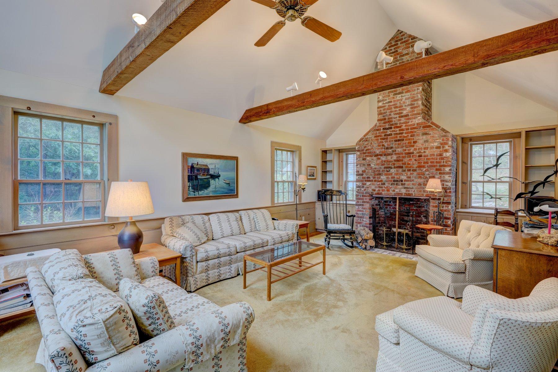 40 Viking Road Orleans, MA 02653 - Photo 8 of 27 a living room with furniture and a large window
