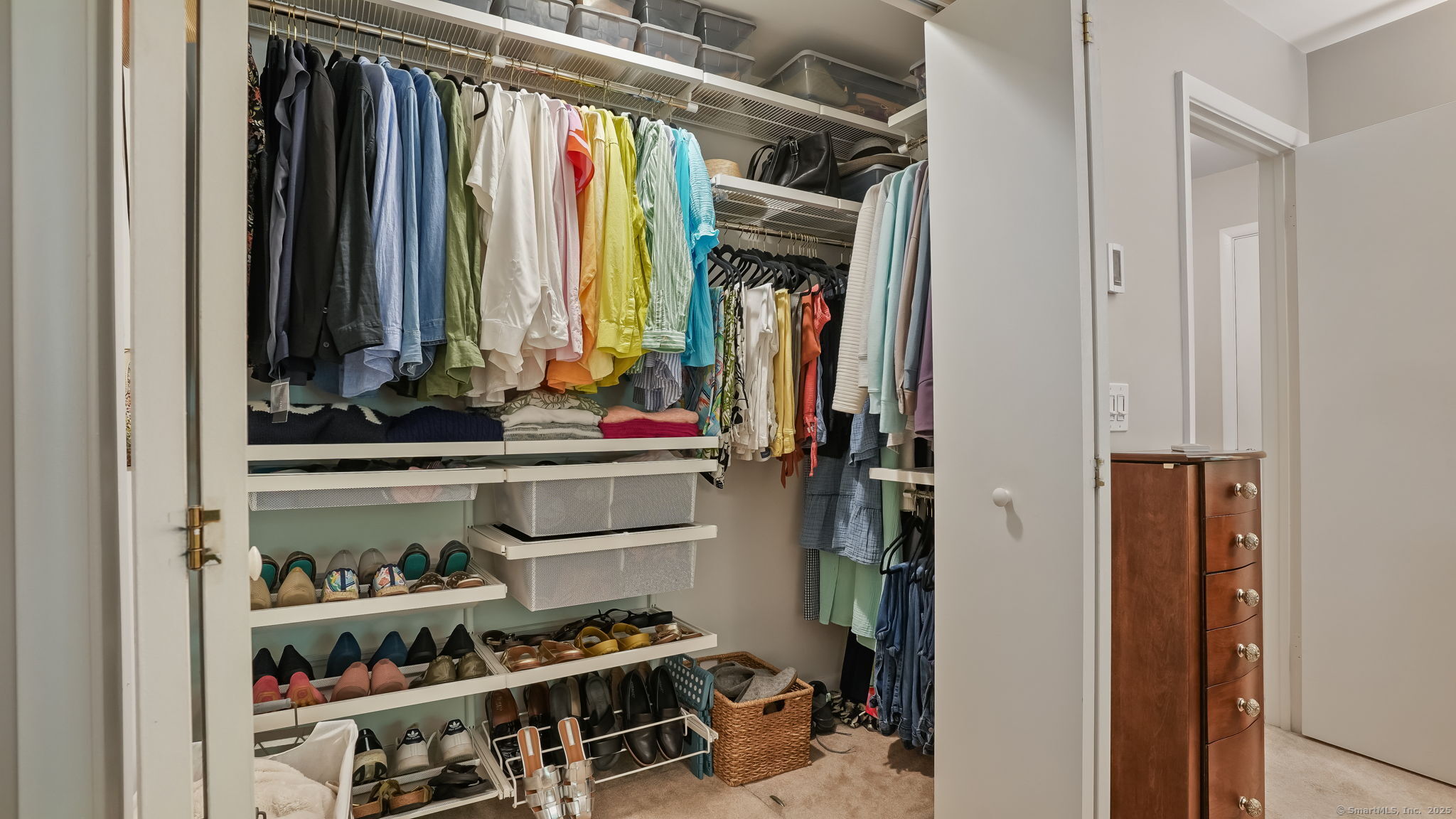 97 Richards Avenue, Unit B10 Norwalk, CT 06854 - Photo 20 of 35 a view of walk in closet with clothes and shoes