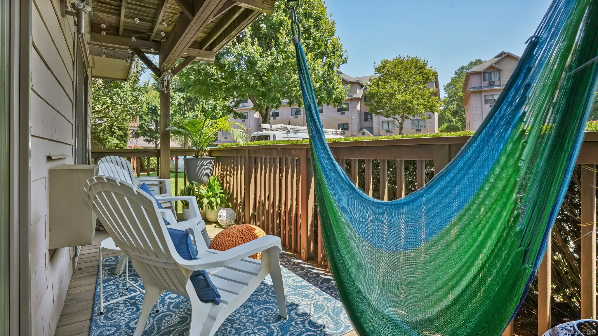 97 Richards Avenue, Unit B10 Norwalk, CT 06854 - Photo 28 of 35 a balcony with two chairs and a table
