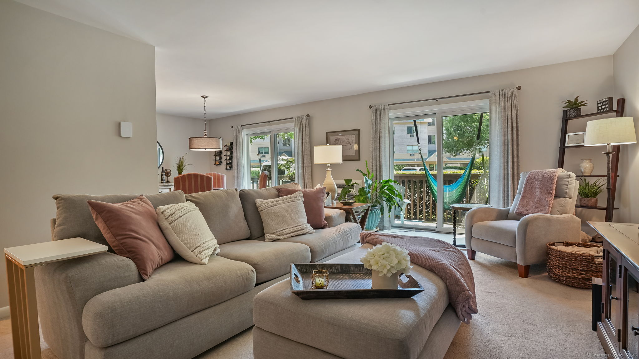 97 Richards Avenue, Unit B10 Norwalk, CT 06854 - Photo 6 of 35 a living room with furniture and a large window