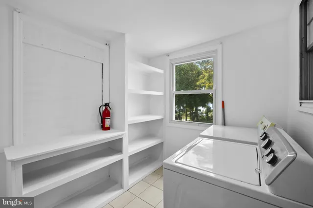 a bathroom with a sink and a window